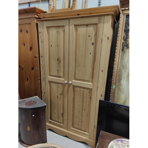 1009 - A good quality modern double door pine wardrobe