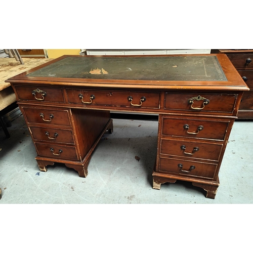 1012 - A reproduction yew wood pedastal desk with leather writing surface