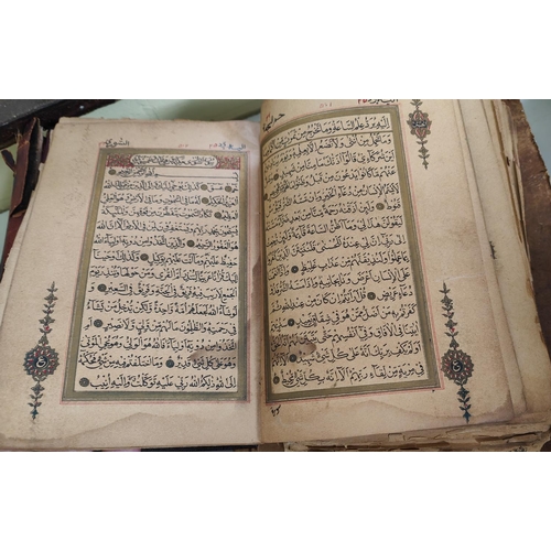 195D - A late 19th/early 20th century Quran Arabic text with gilt and other highlights all backed on later ... 