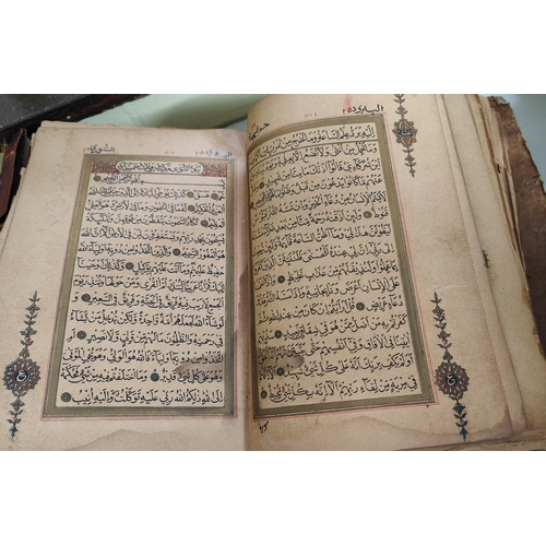 195D - A late 19th/early 20th century Quran Arabic text with gilt and other highlights all backed on later ... 