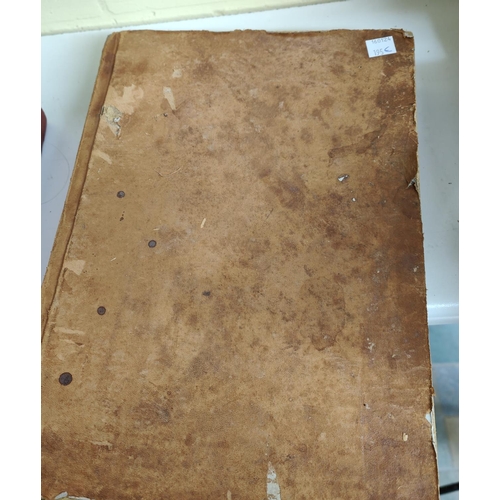 195E - A hand written Quran Arabic text backed onto later book, some text in borders (some moth damage)