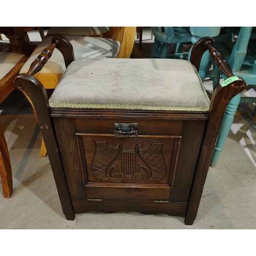 893 - An Edwardian stained walnut music stool with fall front compartment below and a 1930's low seat armc... 