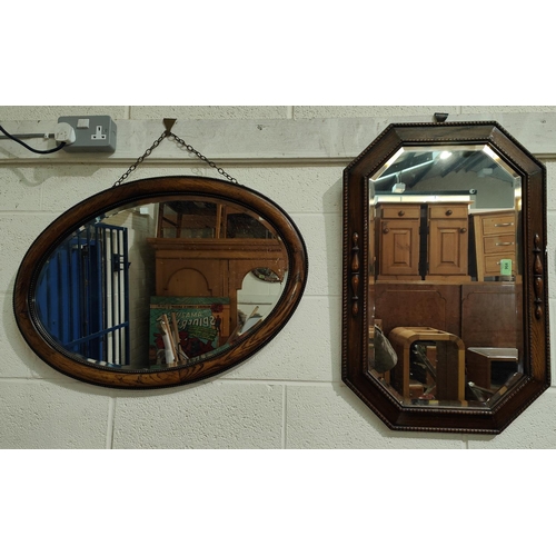 956 - A 1930's beaded and canted wall mirror and an oval wall mirror