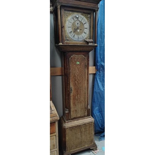 986 - An 18th century oak and mahogany long case clock with cross banded decoration, having caddy top hood... 