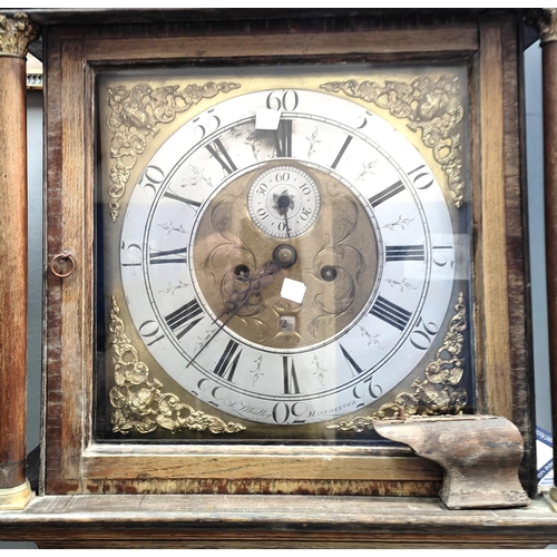 986 - An 18th century oak and mahogany long case clock with cross banded decoration, having caddy top hood... 