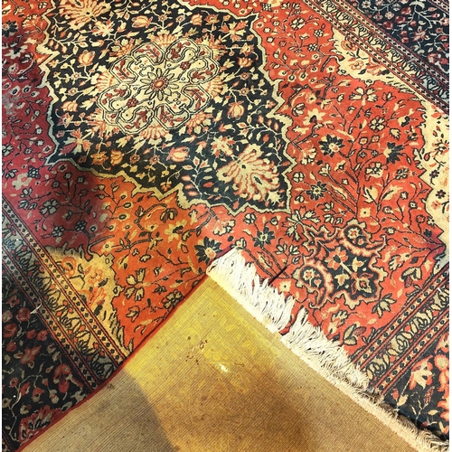 1004 - A Middle Eastern style red ground carpet