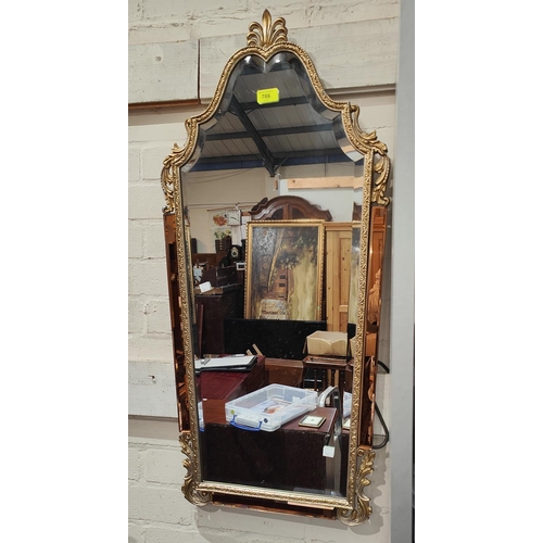 1007 - A wall mirror in the French manner with gilt frame and peach border, and a large cream framed circul... 