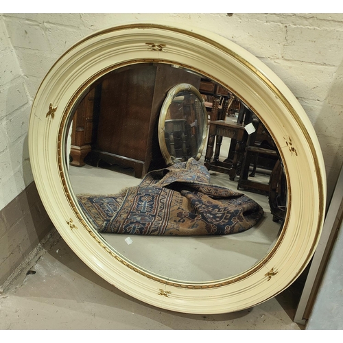 1007 - A wall mirror in the French manner with gilt frame and peach border, and a large cream framed circul... 