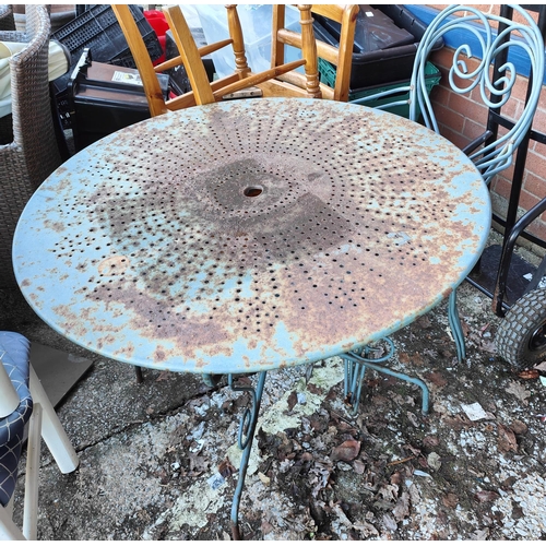 1008 - A garden two seater table in green (some rusting) with two chairs