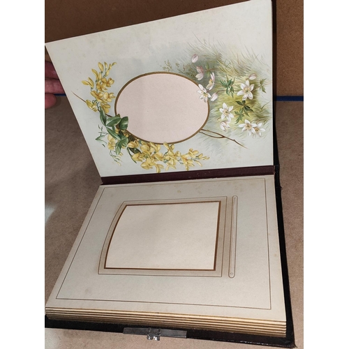 119 - An Edwardian embossed leather photo frame (unused) and dated '04