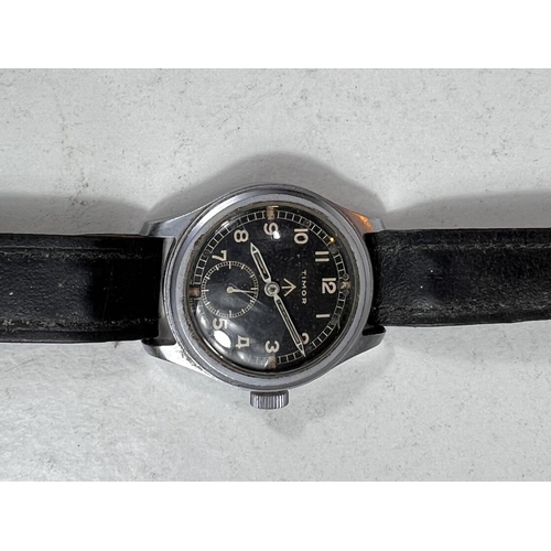 654 - A British military issue wristwatch Timor Dirty Dozen, with black dial and Arabic numerals, military... 