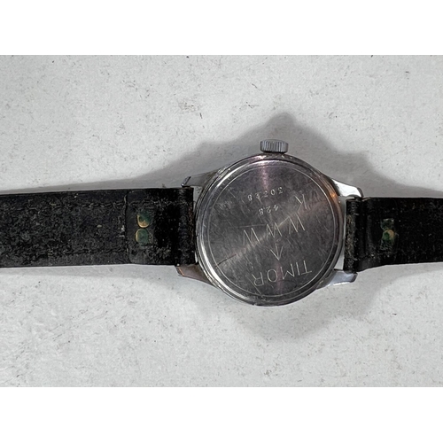 654 - A British military issue wristwatch Timor Dirty Dozen, with black dial and Arabic numerals, military... 