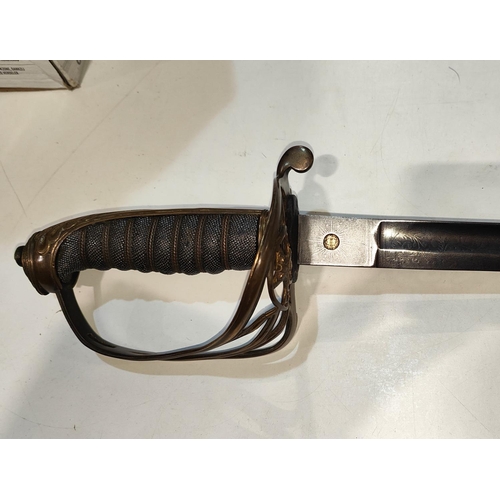 220 - A 19th century Infantry Officer's sword by Robert Mole, with brass basket hilt, decoration to blade