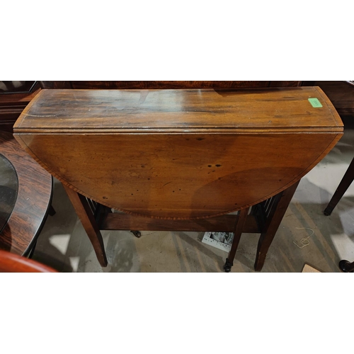 1000 - An Edwardian oval walnut Sutherland table on square splay legs