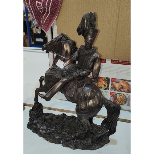 228 - A bronzed figure of a soldier on horseback; a similar figure of a solder with musket