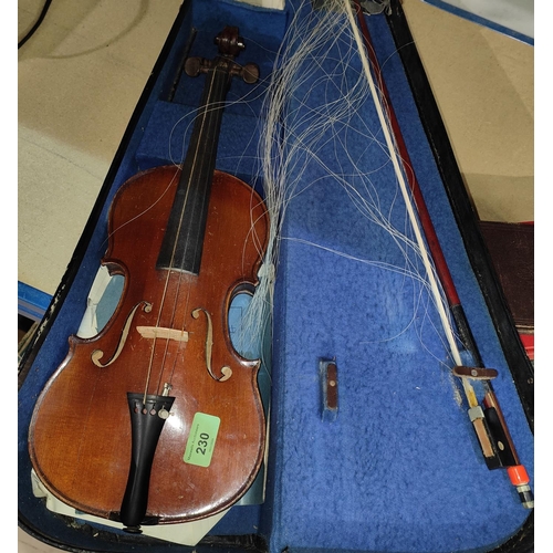 230 - An early 20th century child's violin lettered 'Jean Renard à Rennes', overall length 52cm, with bow ... 