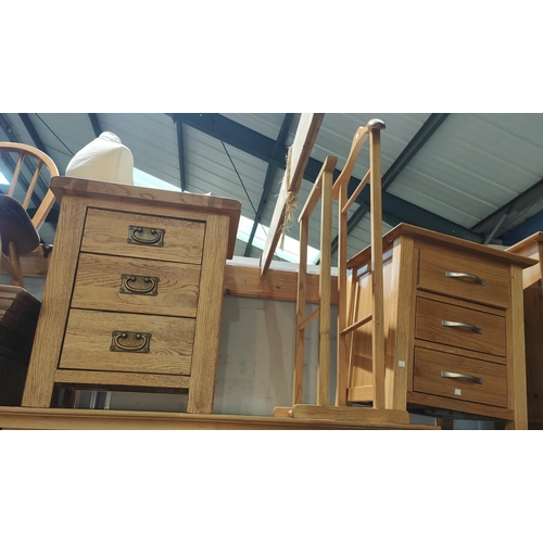 887 - A modern light oak 3 height bedside cabinet; a similar cabinet; a valet stand