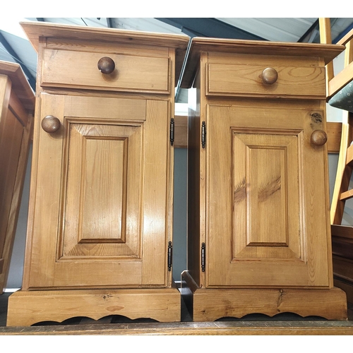 888 - A pair of pine bedside cabinets; a pine framed free standing mirror