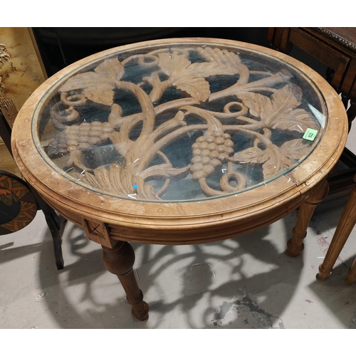 922 - A light wood occasional table with carved grapevine under glass, an oak nest of three tables barley ... 