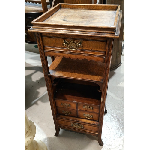 892 - A Victorian oak bedside cabinet/whatnot with 2 open shelves and 6 drawers