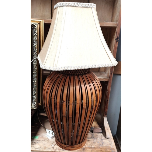 895 - An unusual bamboo basket lamp and a stained wood standard lamp