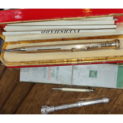 180B - A selection of silver and gilt pencils etc