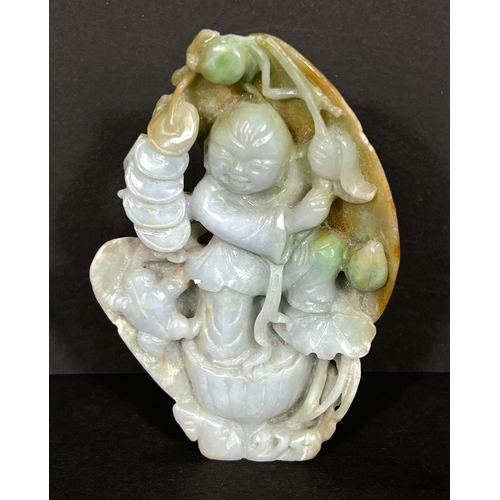 103 - A Chinese carving in jade coloured hardstone depicting a man holding a branch, with shells to rear, ... 