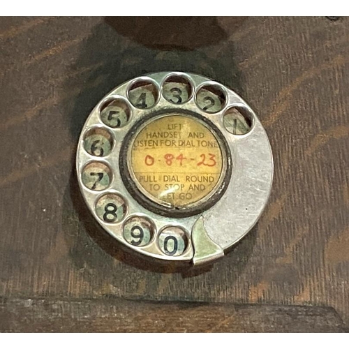 104 - An early 20th century Western Electric made in the USA, oak cased wall telephone with bakelite fitti... 