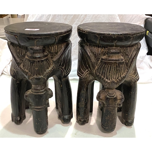 105 - A pair of african carved stools in the form of elephants; and a vintage Rossman sewing machine.