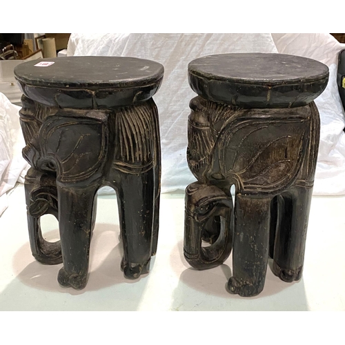 105 - A pair of african carved stools in the form of elephants; and a vintage Rossman sewing machine.