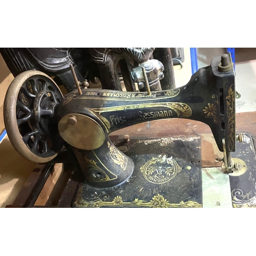 105 - A pair of african carved stools in the form of elephants; and a vintage Rossman sewing machine.