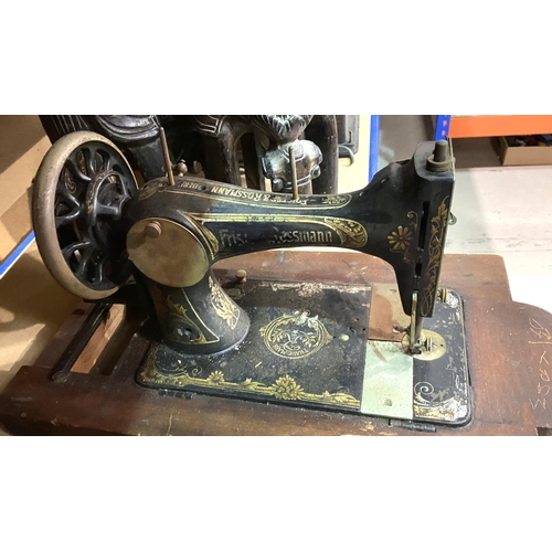 105 - A pair of african carved stools in the form of elephants; and a vintage Rossman sewing machine.