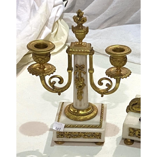 109 - A late 19th/early 20th century clock garniture, Louis XVI style in ormolu and white marble, the cent... 