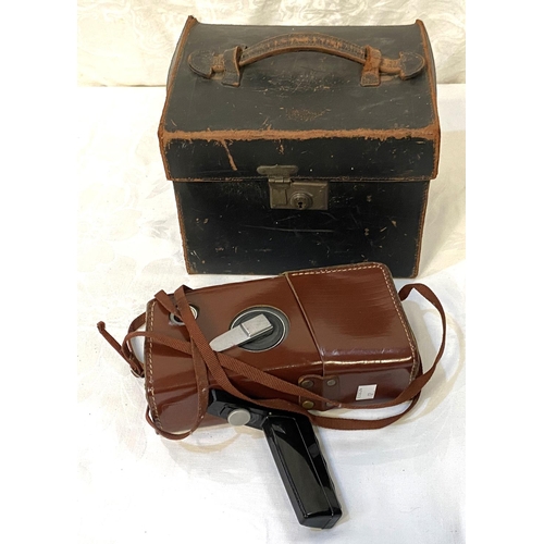 12 - A 19th century plate camera in leather case; a vintage windup cine camera