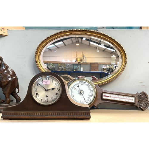 16 - A carved oak aneroid barometer with thermometer; an oak cased chiming mantle clock; an oval gilt fra... 