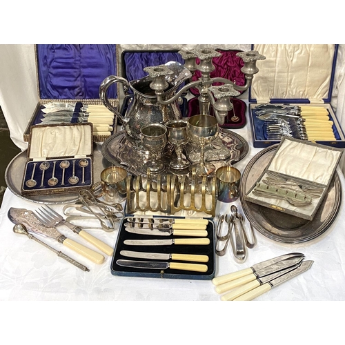 26 - A selection of silver plate:  5-branch candelabrum; serving platters; cutlery; etc.