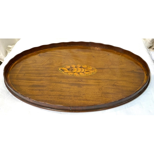 4 - A mahogany oval 2-handled tray with central shell motif