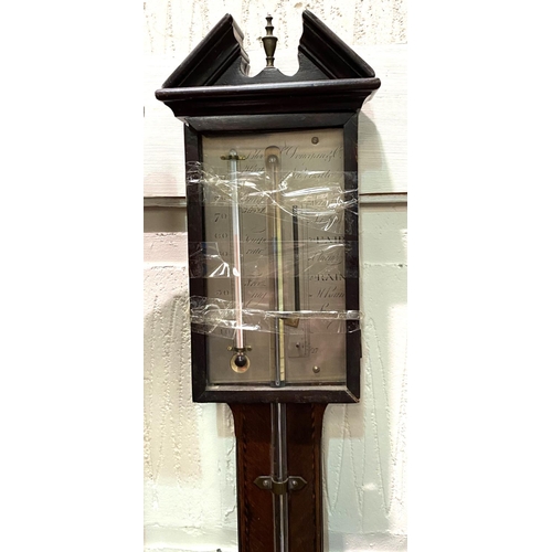 5 - A Georgian stick barometer, the mahogany case with architectural pediment, boxwood and ebony string ... 