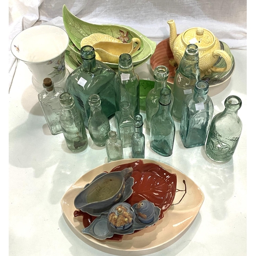 51 - A selection of Carltonware green leaf pieces; a selection of vintage glass bottles, some with g... 