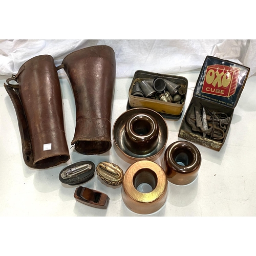 70 - A pair of 20th century leather garters, a miniature plane, tins with vintage piping nozzles etc; a s... 