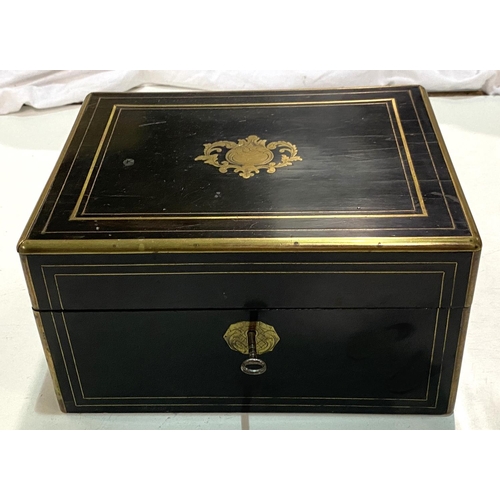 80 - A 19th century ebonised and brass box with silver and copper lidded fitted jars in fitted sections.