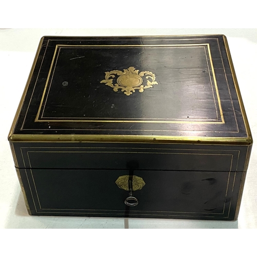 80 - A 19th century ebonised and brass box with silver and copper lidded fitted jars in fitted sections.