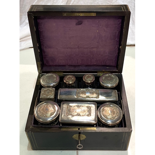 80 - A 19th century ebonised and brass box with silver and copper lidded fitted jars in fitted sections.