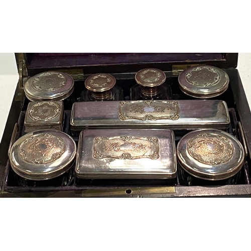 80 - A 19th century ebonised and brass box with silver and copper lidded fitted jars in fitted sections.