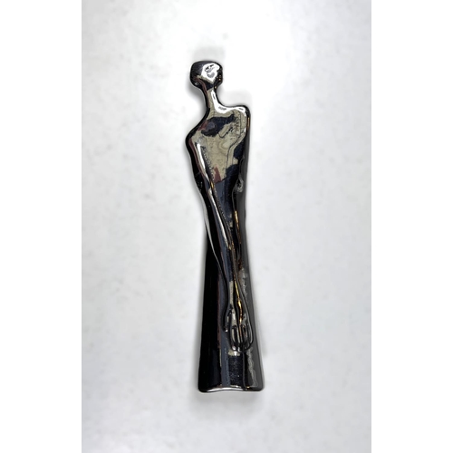 83 - A white metal modernist unusual shoehorn in the form of a female, signed Carrol Boyes, South Africa,... 