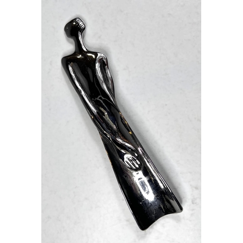 83 - A white metal modernist unusual shoehorn in the form of a female, signed Carrol Boyes, South Africa,... 