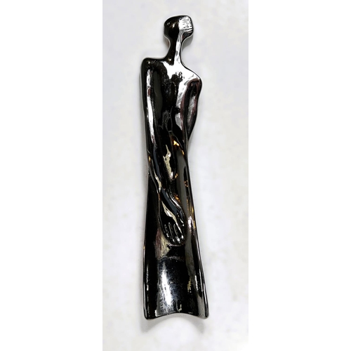 83 - A white metal modernist unusual shoehorn in the form of a female, signed Carrol Boyes, South Africa,... 