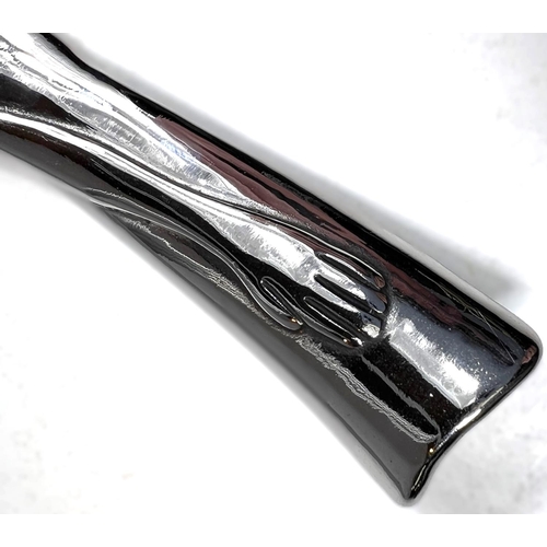 83 - A white metal modernist unusual shoehorn in the form of a female, signed Carrol Boyes, South Africa,... 