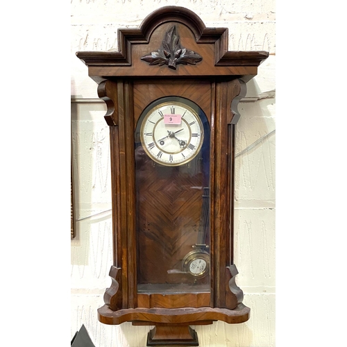 9 - A 19th century Vienna wall clock in walnut case, spring driven, with strike