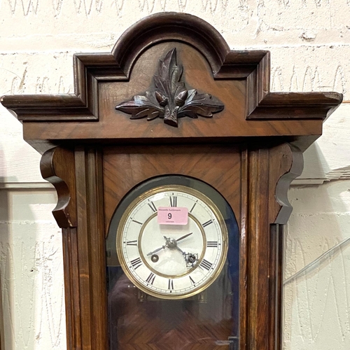 9 - A 19th century Vienna wall clock in walnut case, spring driven, with strike